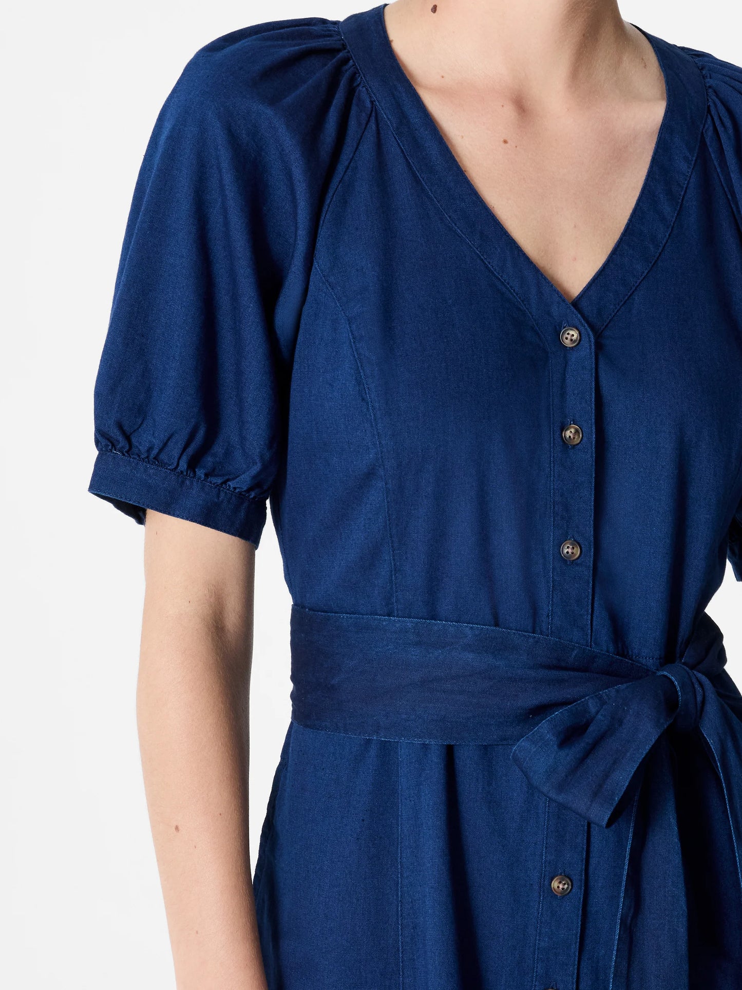 Woman wearing a dark blue maxi button through dress with V -Neck, short sleeves and tie waist.