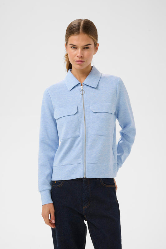 Woman wearing the InWear Beca cardigan with collar, front pockets and zip fastening. In Endless sky blue colour.