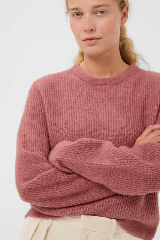 Woman wearing the InWear Nias crew neck pullover in a rose pink colour.