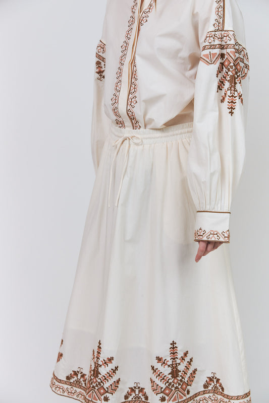 Lollys Laundry Lucia Shirt in Creme with intricate cinnamon-toned embroidery and concealed button fastening
