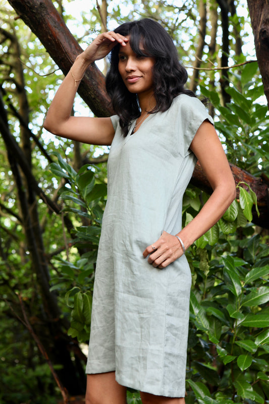 Woman wearing the Lucie Linen Olive Green Knee length Dress
