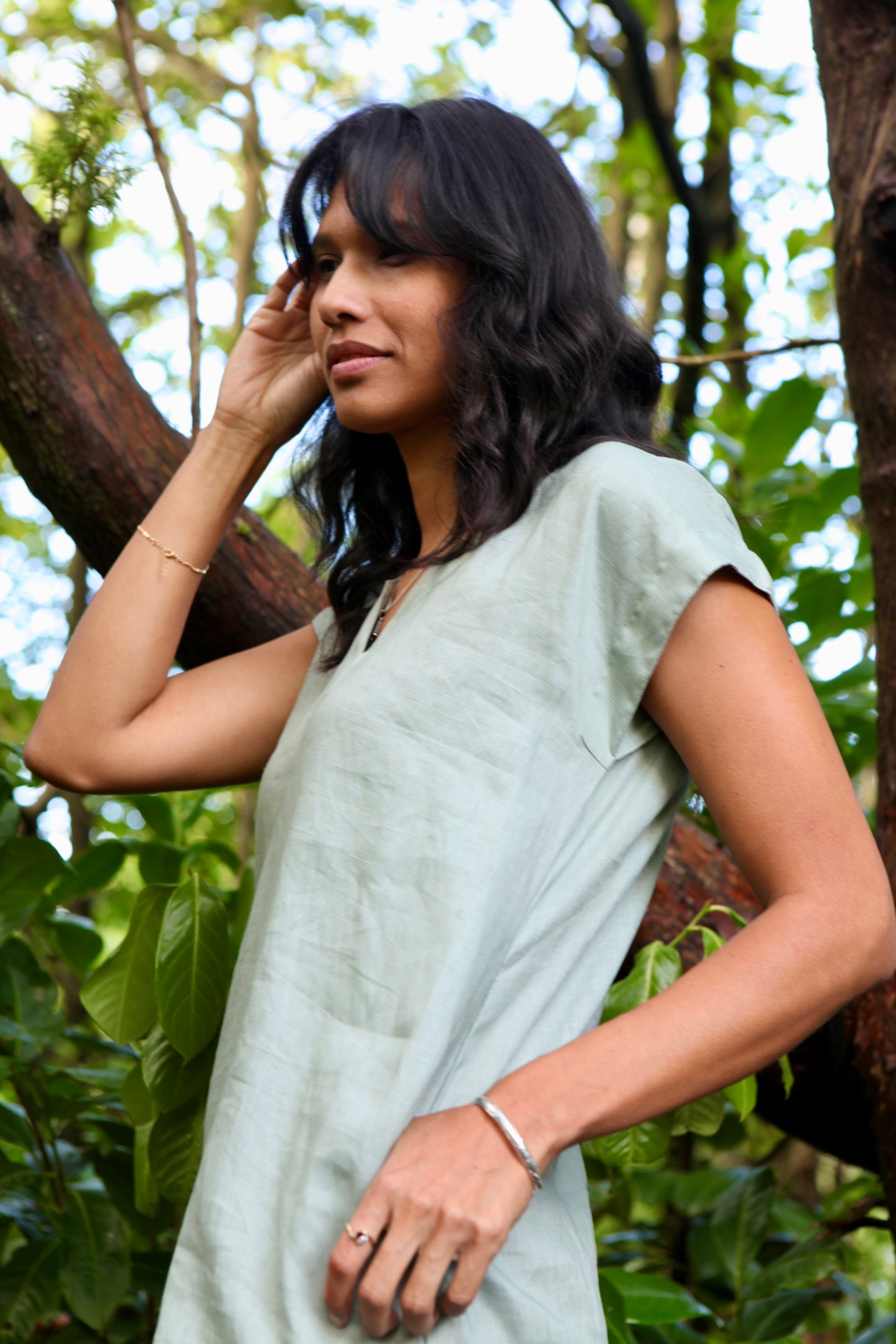 Woman wearing the Lucie Linen Olive Green Knee length Dress