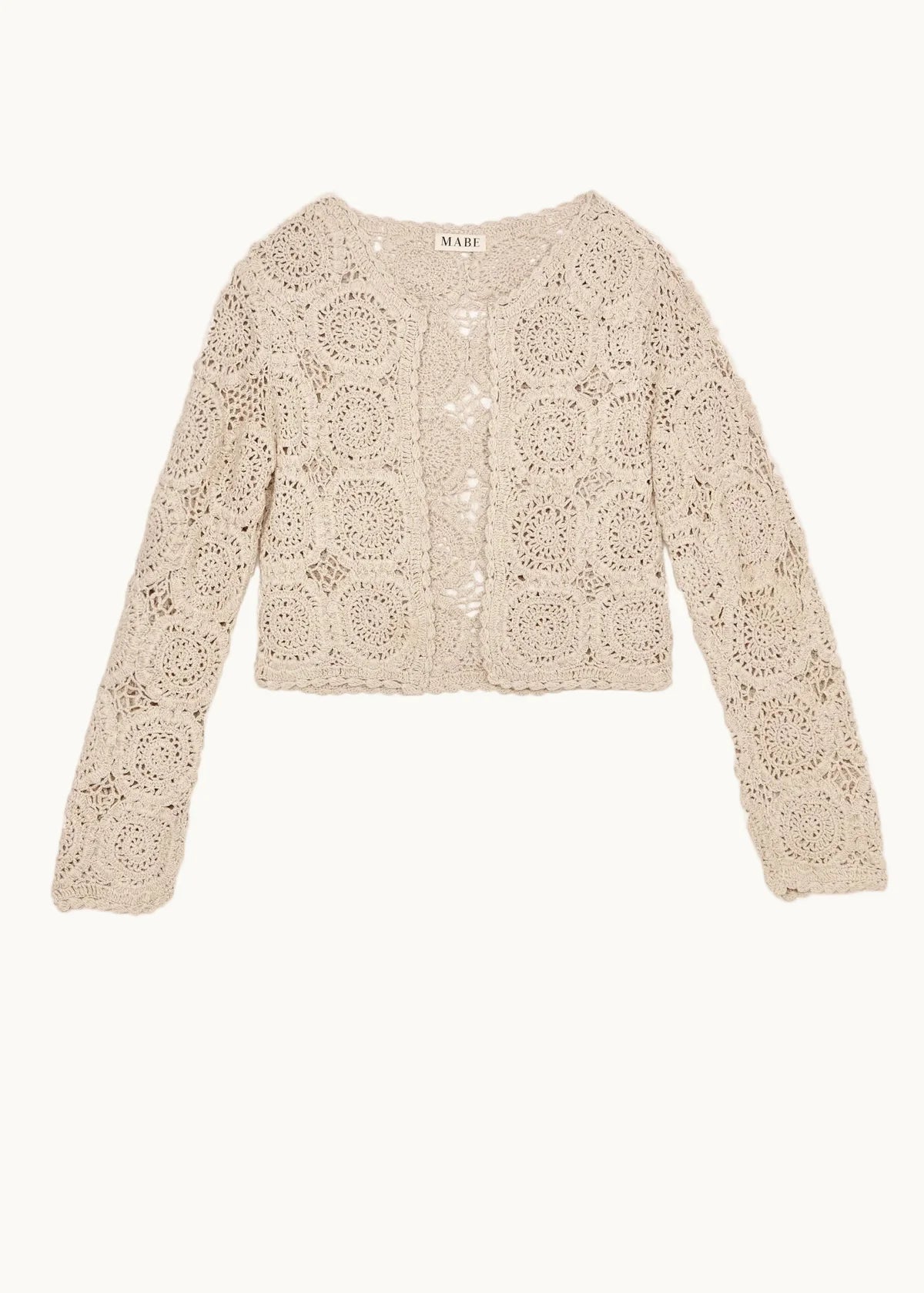 Woman wearing the M.A.B.E Maci beige crochet cardigan