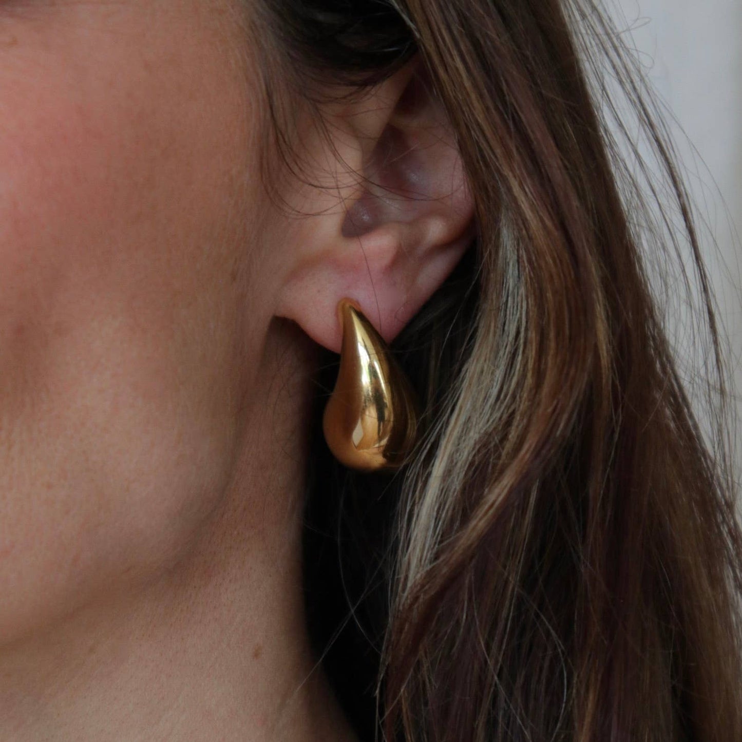 Waterproof gold drop earring made from stainless steel, tarnish-resistant and durable for everyday wear.
