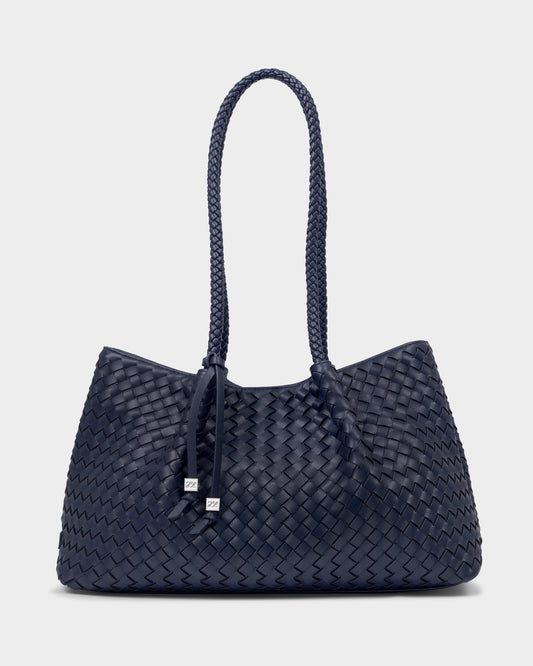 Katie Loxton Nova Navy blue woven handbag with a handle on a white background