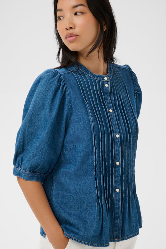 Woman wearing the Part two Alesia Denim Shirt with 3/4 sleeves and folded detailing at the front.