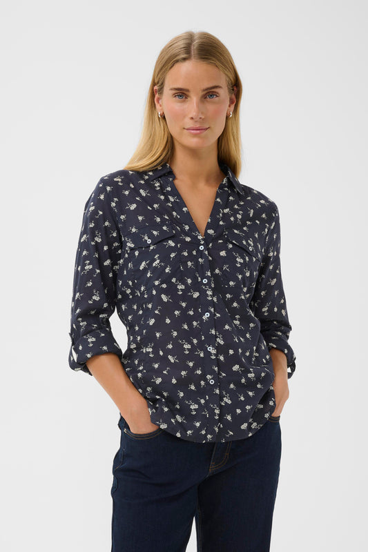 Woman wearing the Part Two Cortnio Shirt in Dark Navy colour with white flowers on it.