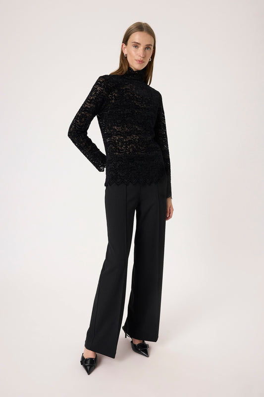 Woman wearing the Soaked in Luxury Sable Lace long sleeved top in black