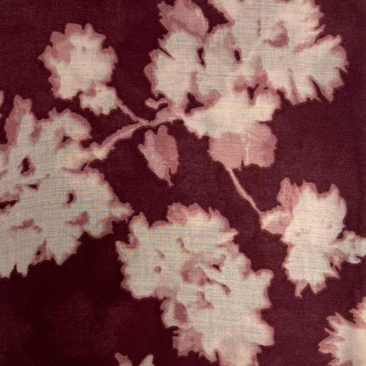 Close-up of a floral pattern with pink flowers on a dark background