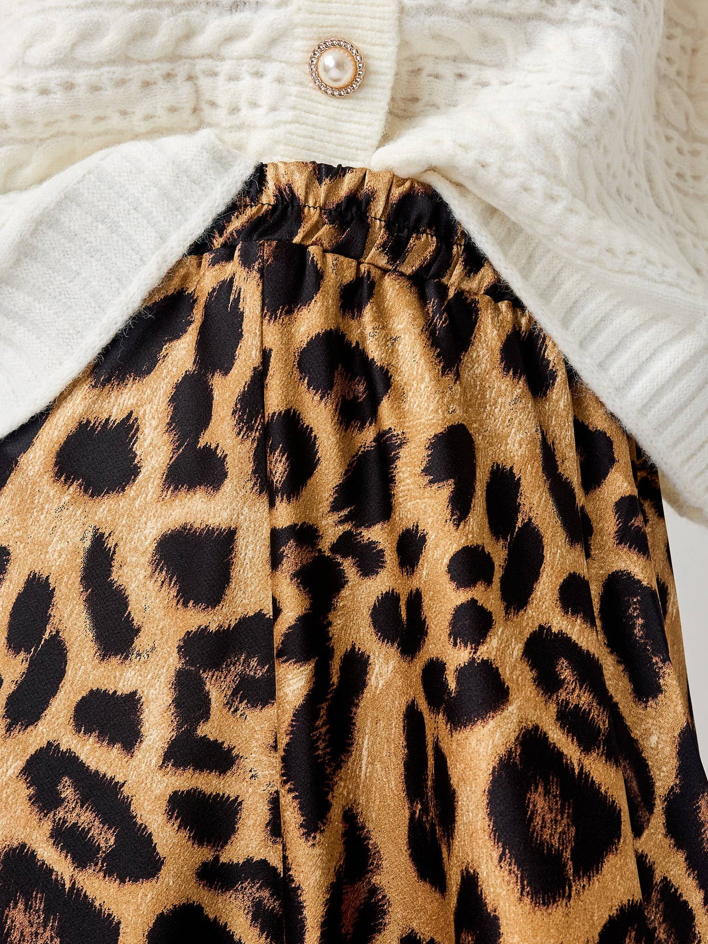 Leopard print skirt with a white sweater