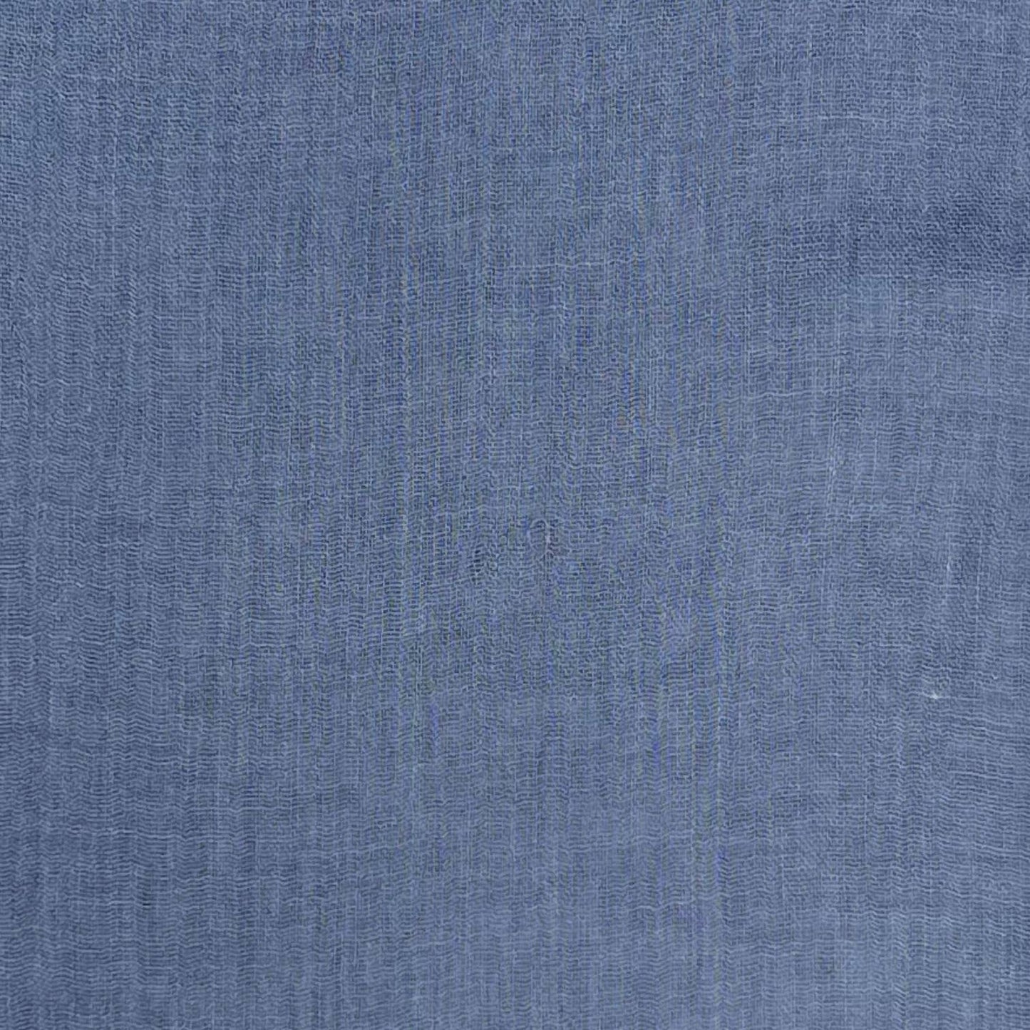 Blue scarf with frayed edges on a white background