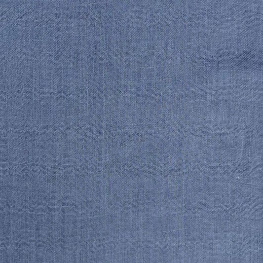 Blue scarf with frayed edges on a white background