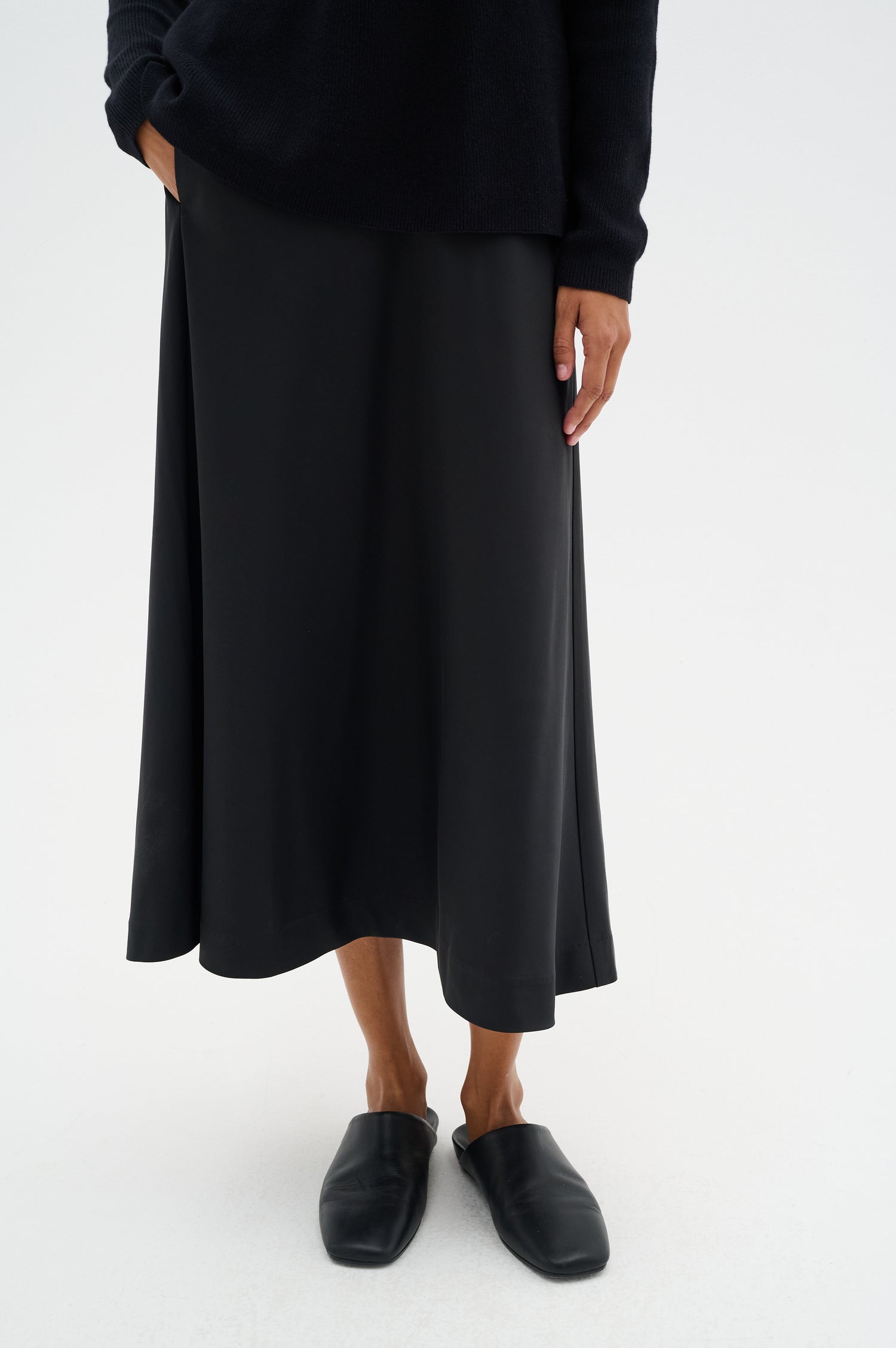 lady wearing a long black satin skirt