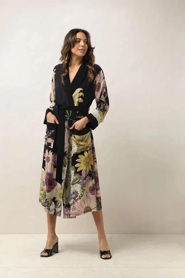 The exquisite prints from One Hundred Stars, featuring short Kimonos, Throwovers, and Gowns, can elevate any ensemble. Adorning one of these beautiful pieces ensures you'll stand out. They are essential additions to any wardrobe.