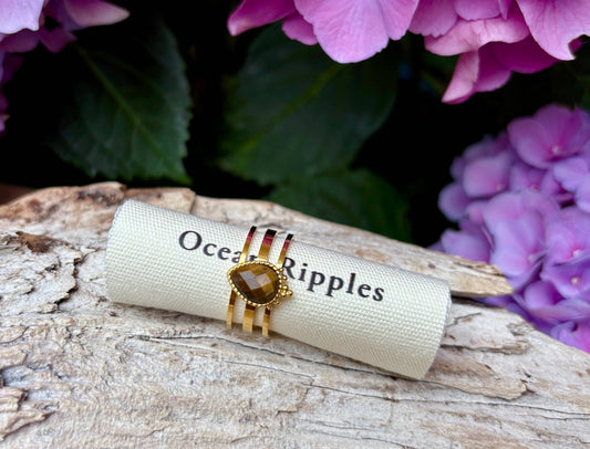 18ct Gold Plated Tiger's Eye Triple Band Ring on ocean ripples branded roll