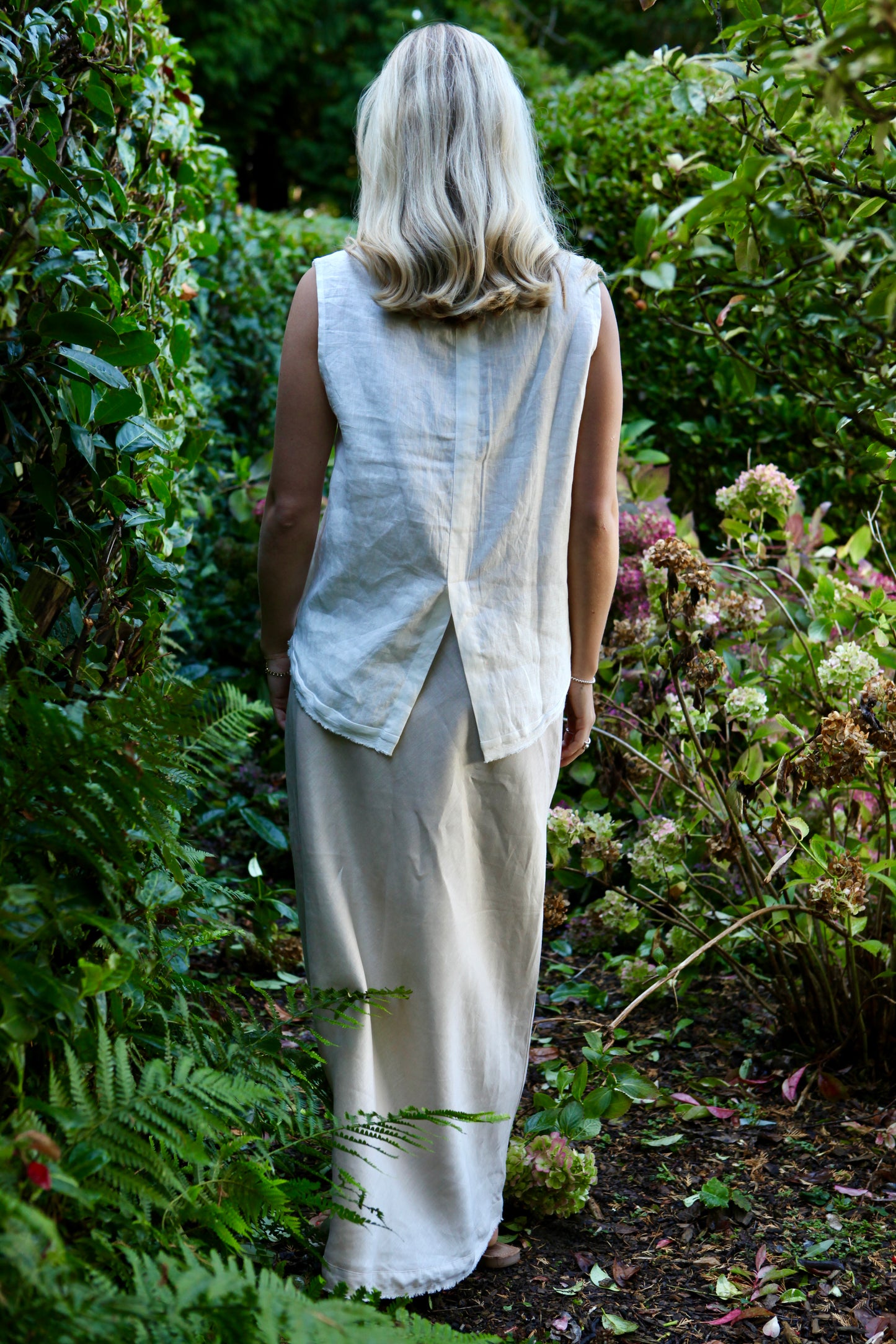 Dear Prudence Aimie Back Detail Top in European flax linen with split-back design and selvage hem detail.