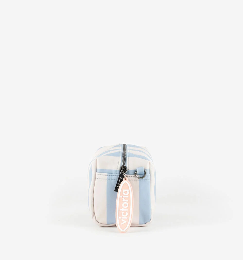 Victoria striped toiletry bag with zip fastening hanging charm and metallic brand plate in azul or amarillo