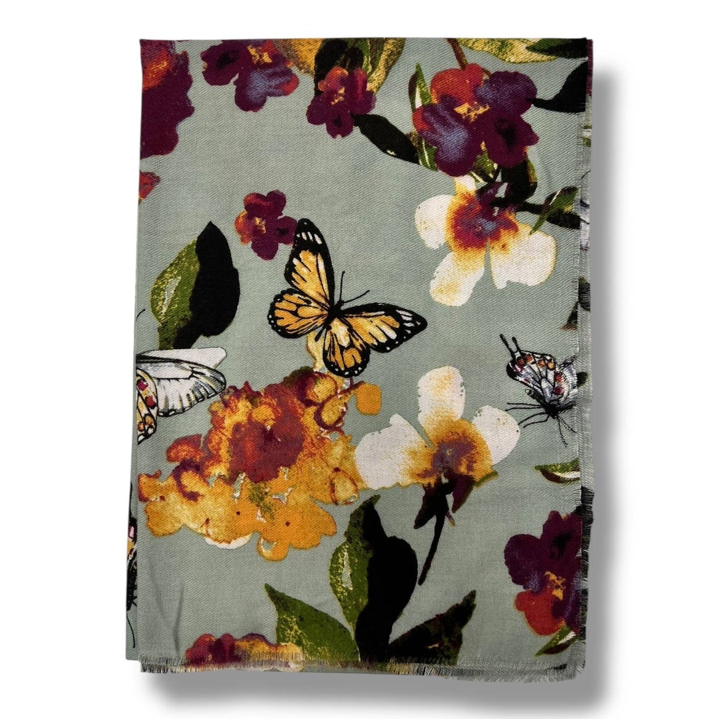 Floral and butterfly patterned fabric on a white background