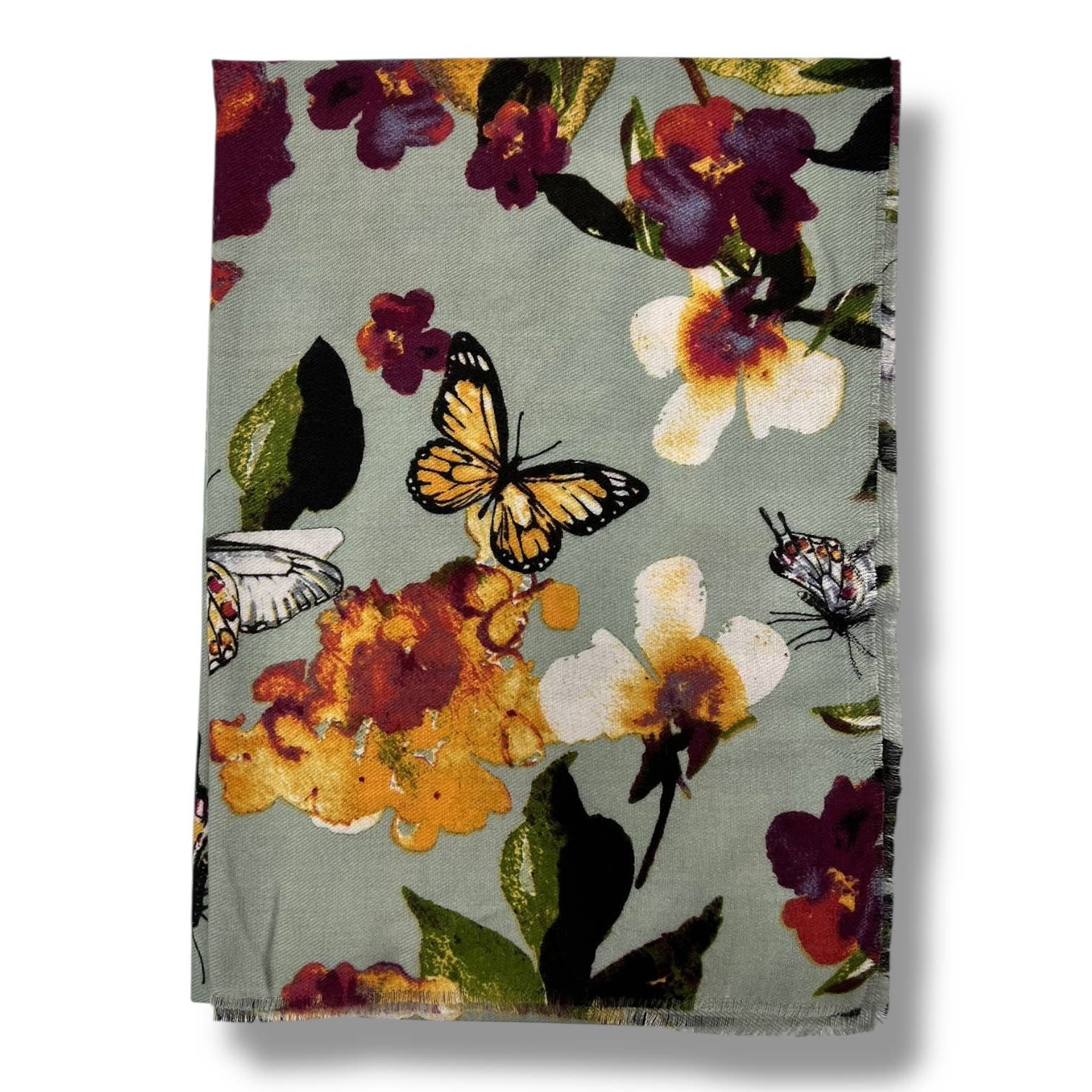 Floral and butterfly patterned fabric on a white background