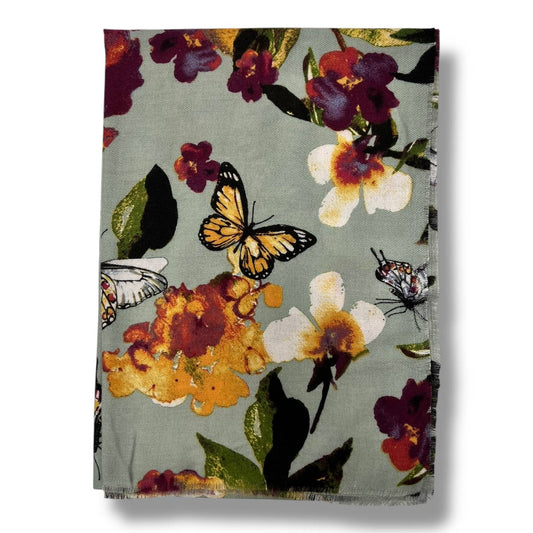 Floral and butterfly patterned fabric on a white background