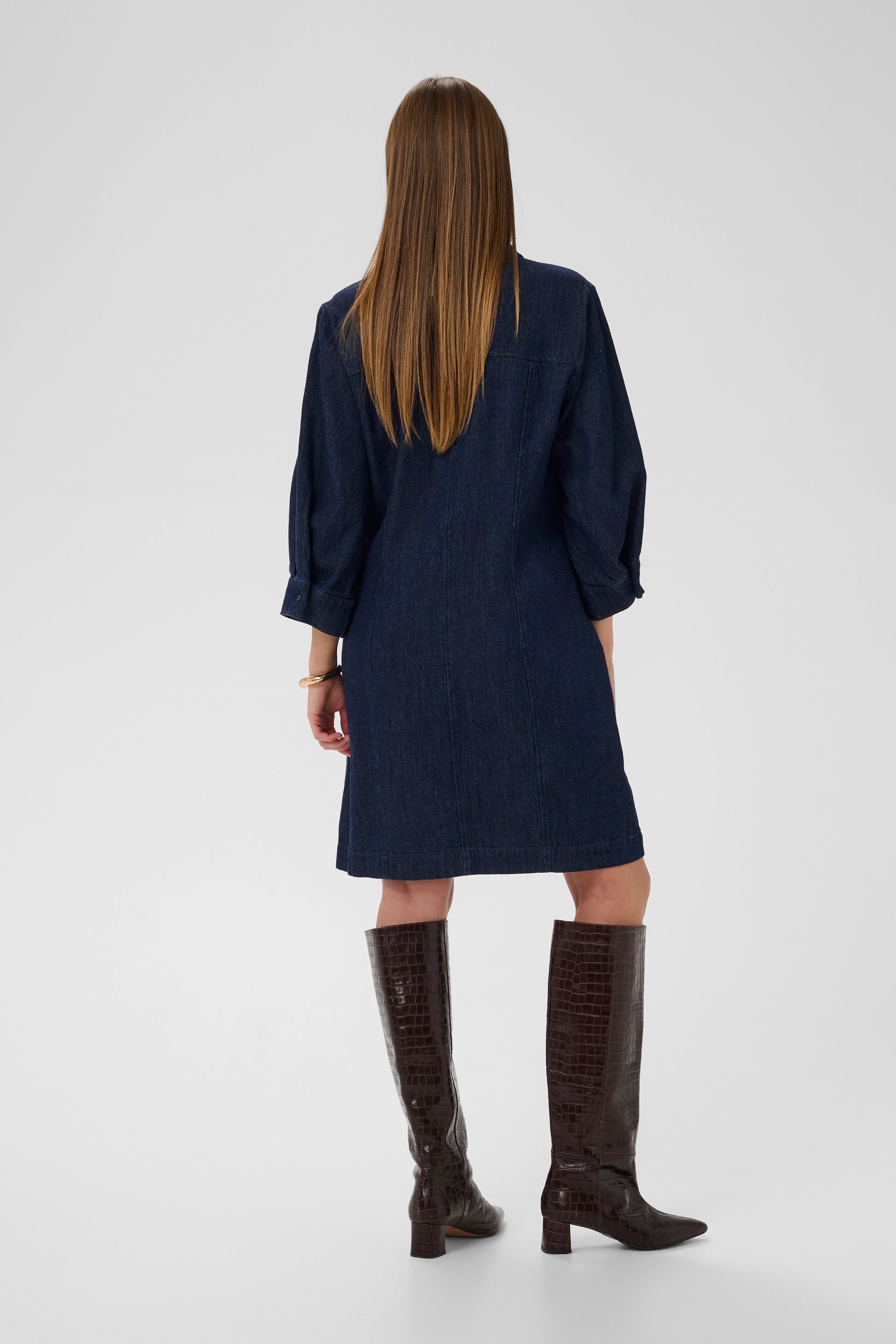 woman wearing the Soaked In luxury Charam Denim knee length dress