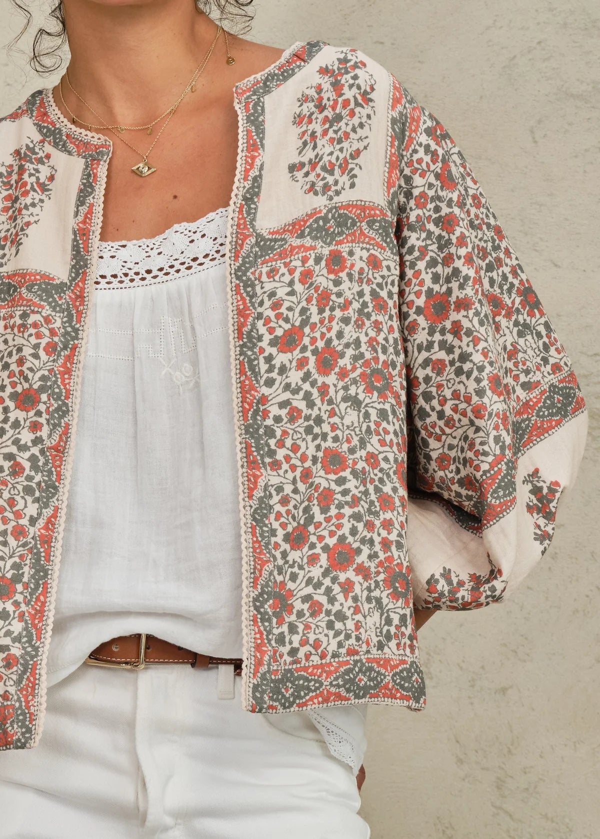 Della Print patterned jacket over a white top on a neutral background