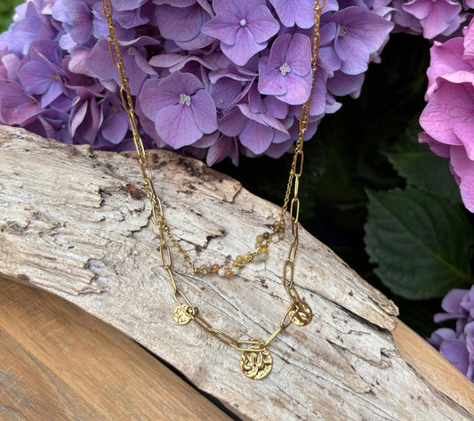 Double layered necklace.  One necklace with beads and another with paperchain chains