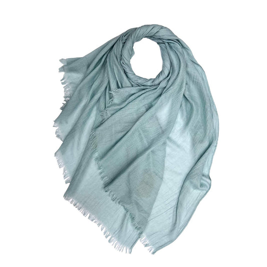 Light blue scarf with frayed edges on a white background