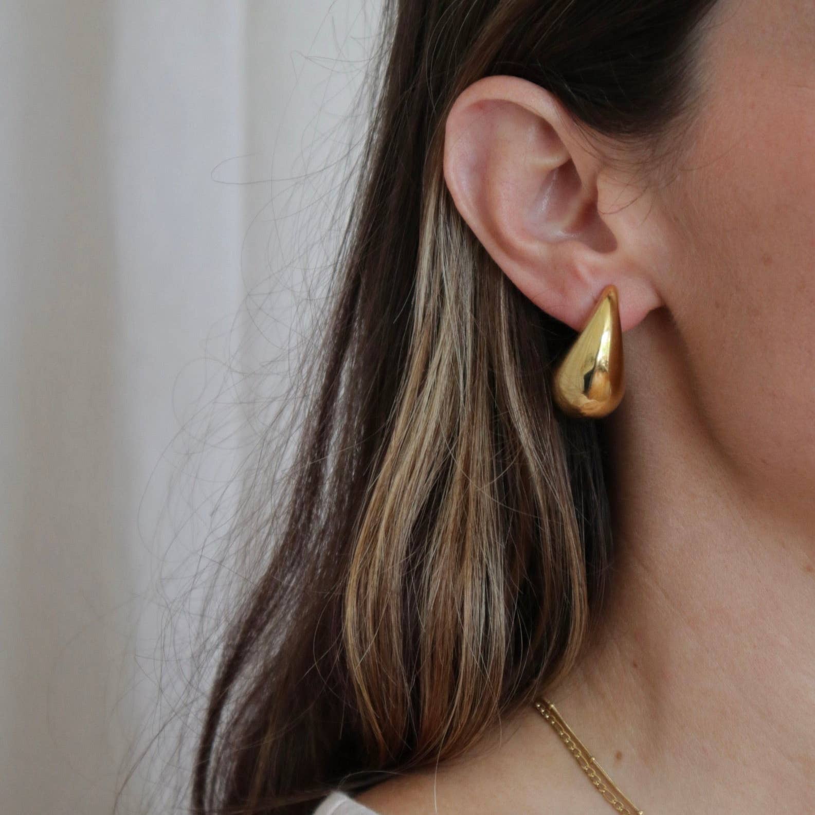 Waterproof gold drop earring made from stainless steel, tarnish-resistant and durable for everyday wear.