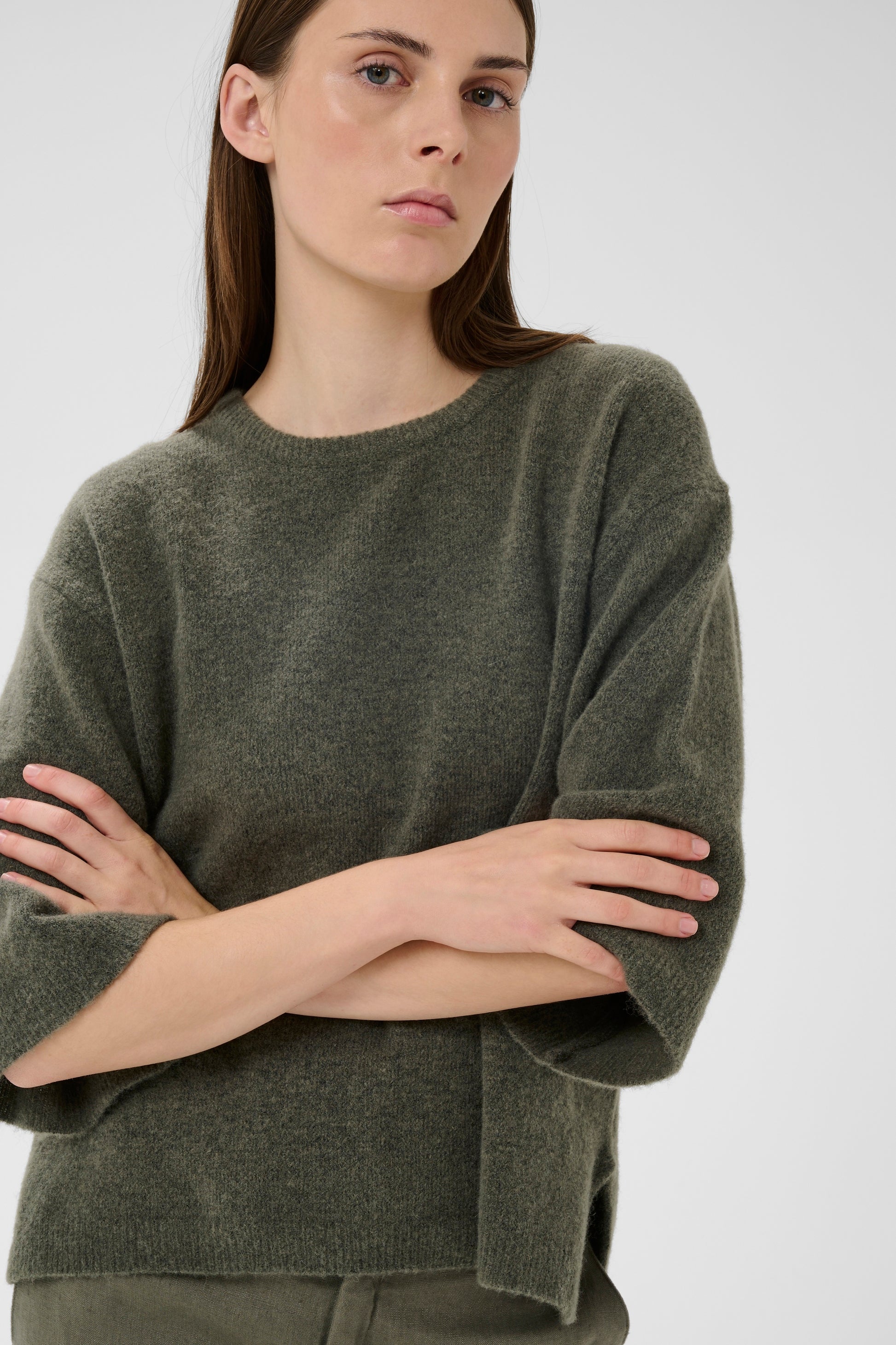 Woman wearing the InWear short sleeved guni tee knit in basil green colour