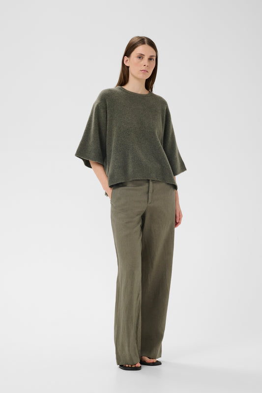 Woman wearing the InWear short sleeved guni tee knit in basil green colour