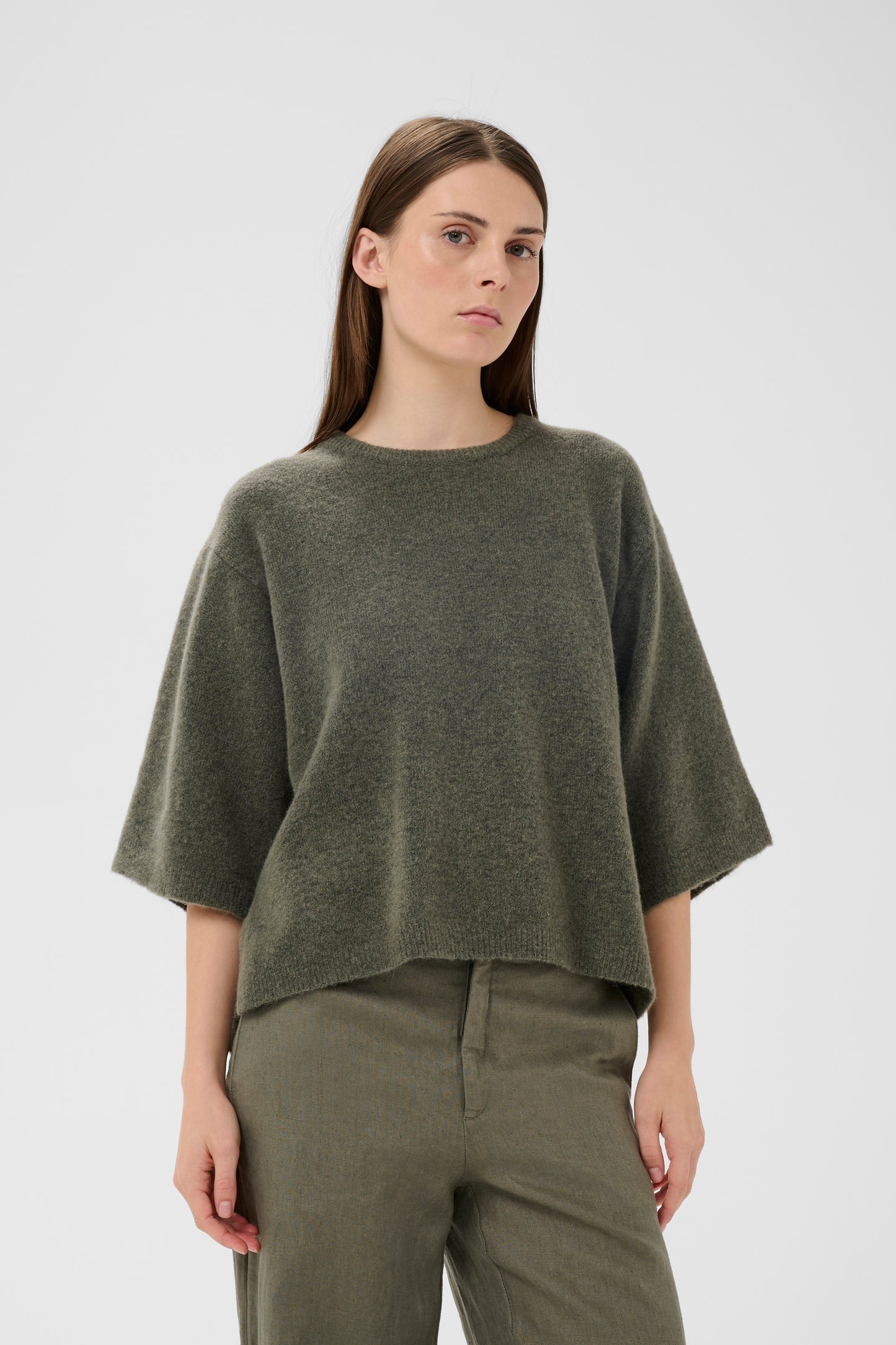 Woman wearing the InWear short sleeved guni tee knit in basil green colour