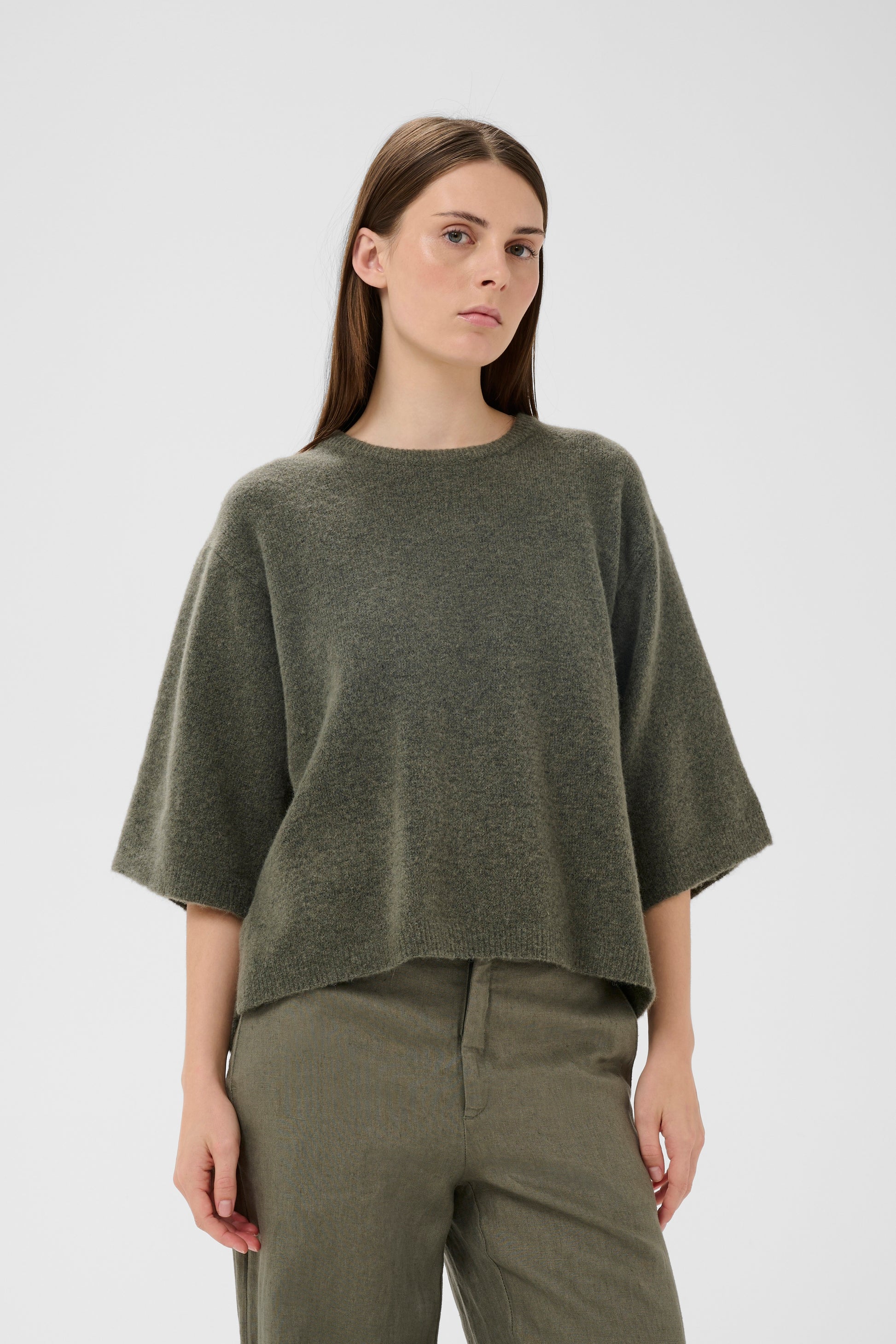 Woman wearing the InWear short sleeved guni tee knit in basil green colour