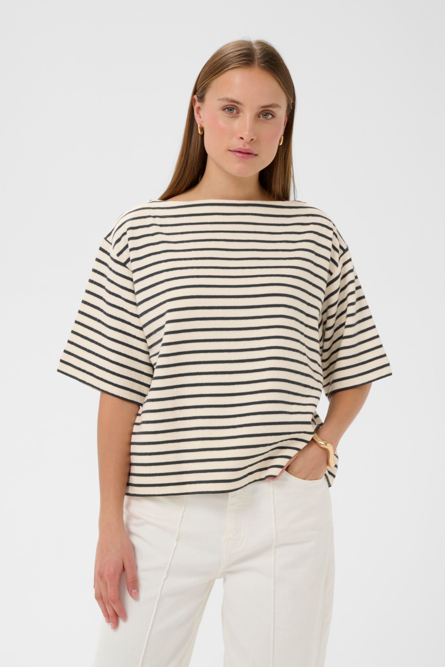 Woman wearing a soaked in luxury black and white striped short sleeved jumper