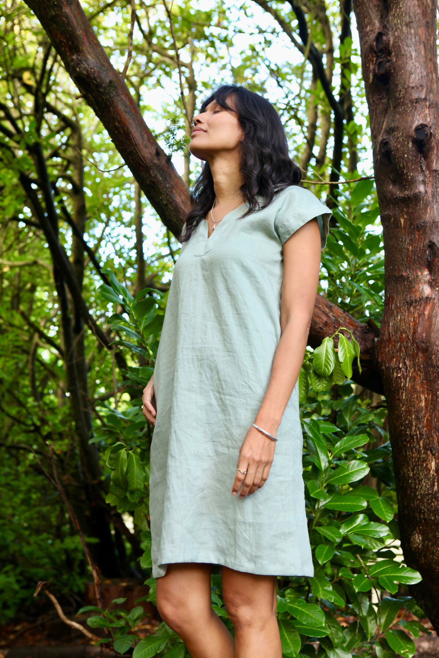 Woman wearing the Lucie Linen Olive Green Knee length Dress