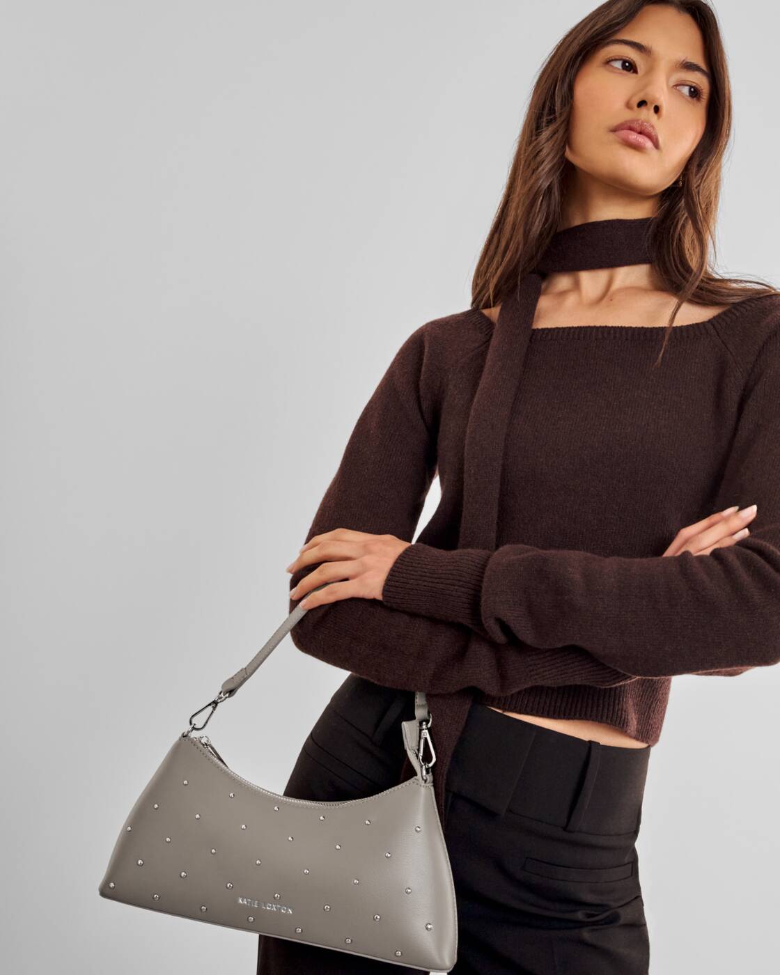 Katie Loxton Miley Small Shoulder Bag in Silver Mink Studded with a sleek silhouette and subtle stud detailing.