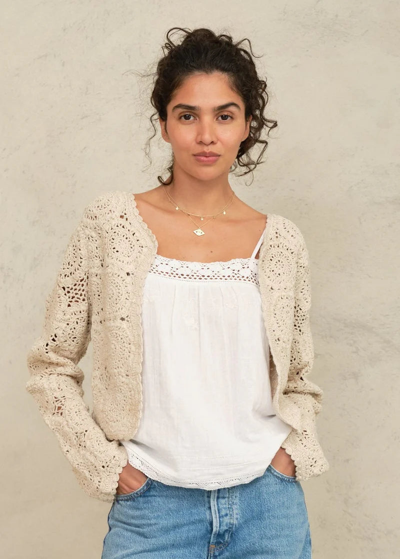 Woman wearing the M.A.B.E Maci  beige crochet cardigan 