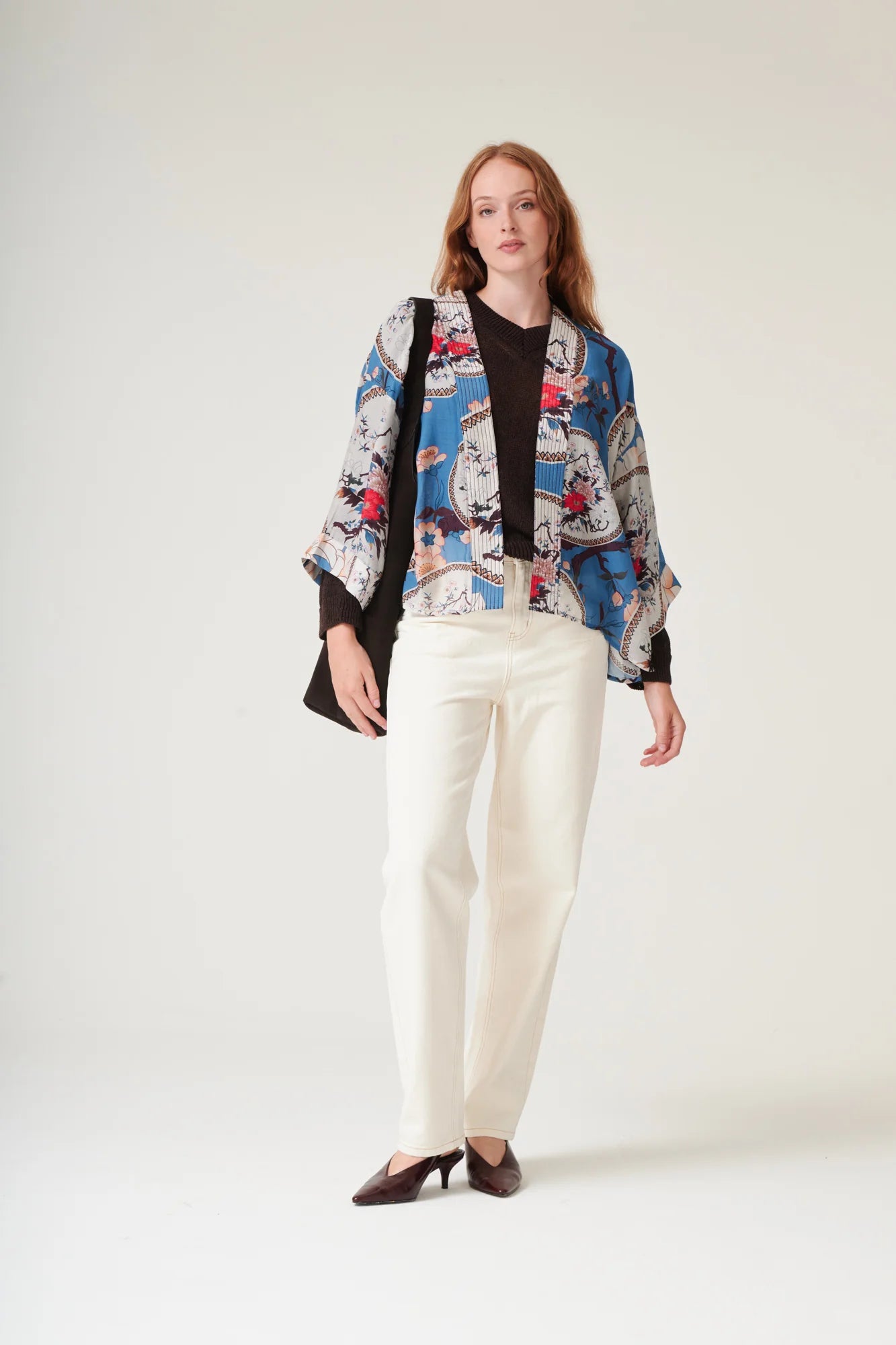 One Hundred Stars Magnolia Plates Blue Kimono featuring an elegant floral print in shades of blue.