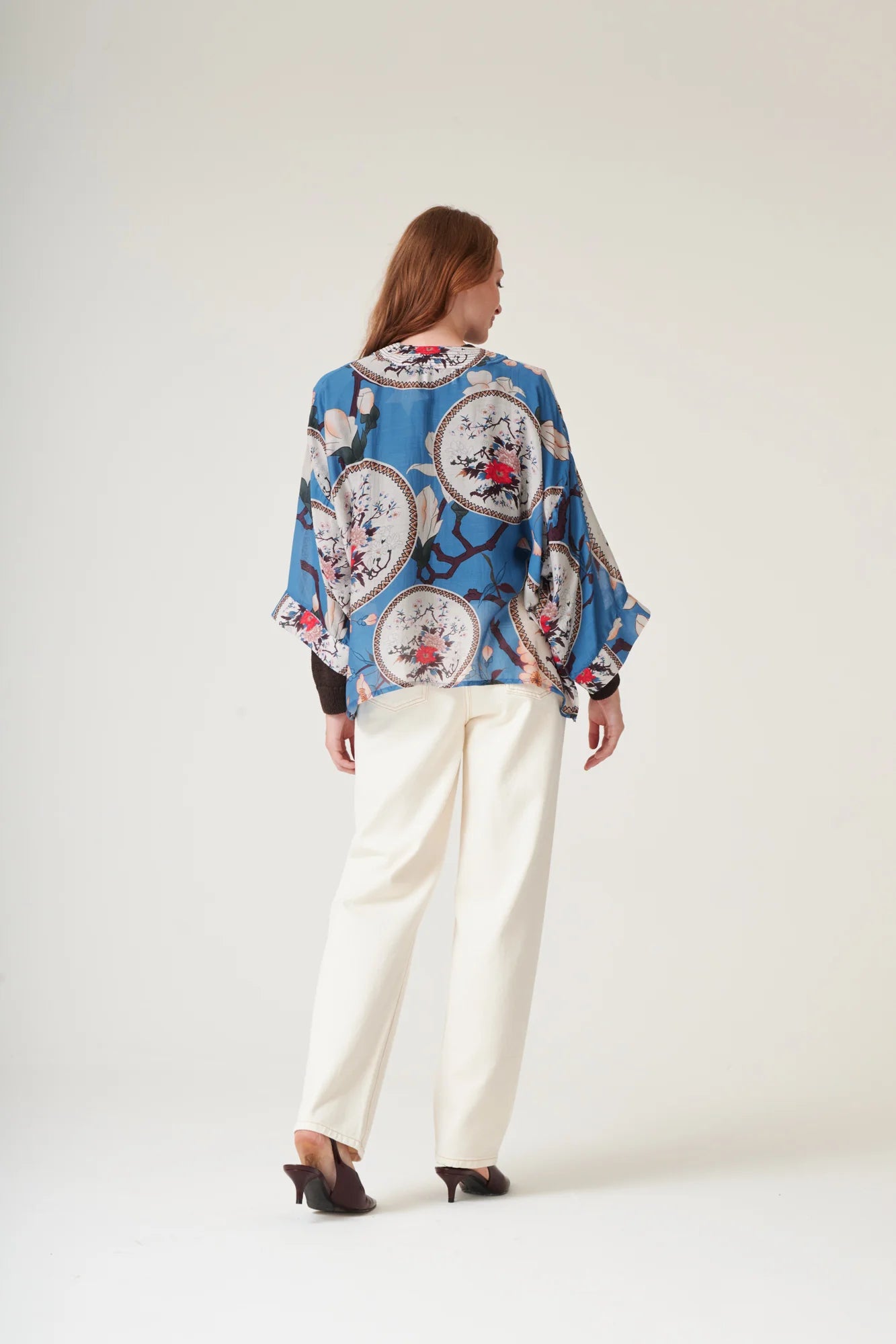 One Hundred Stars Magnolia Plates Blue Kimono featuring an elegant floral print in shades of blue.