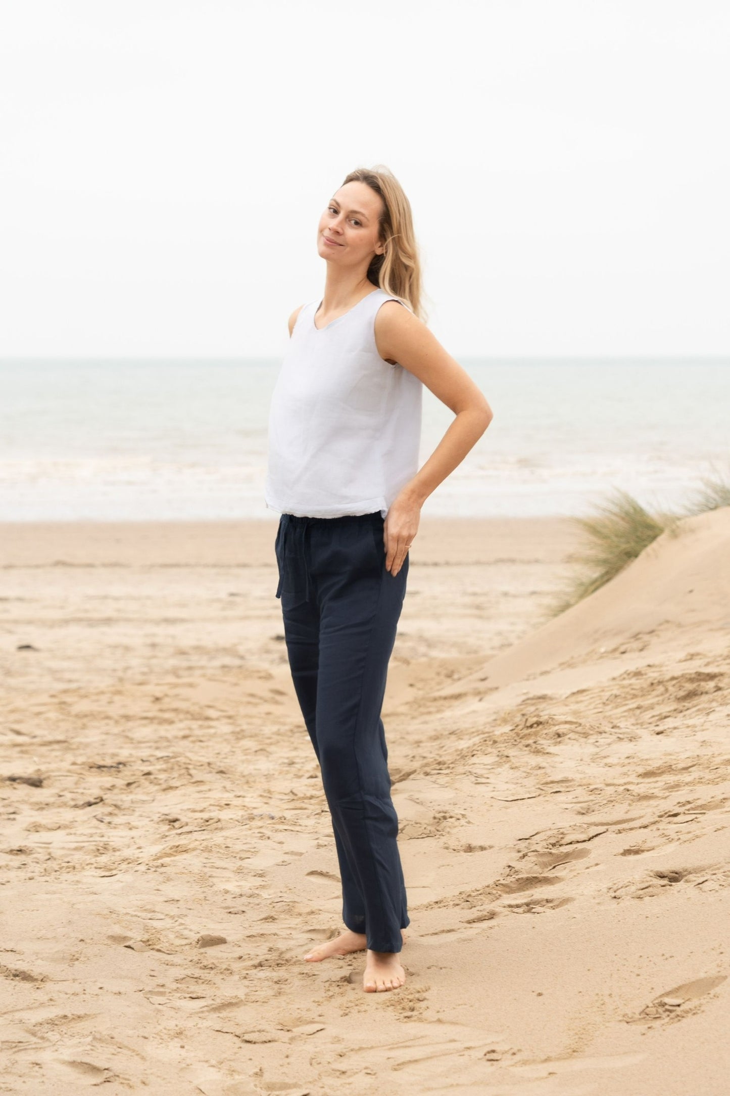woman wearing the Millie Navy blue linen trousers