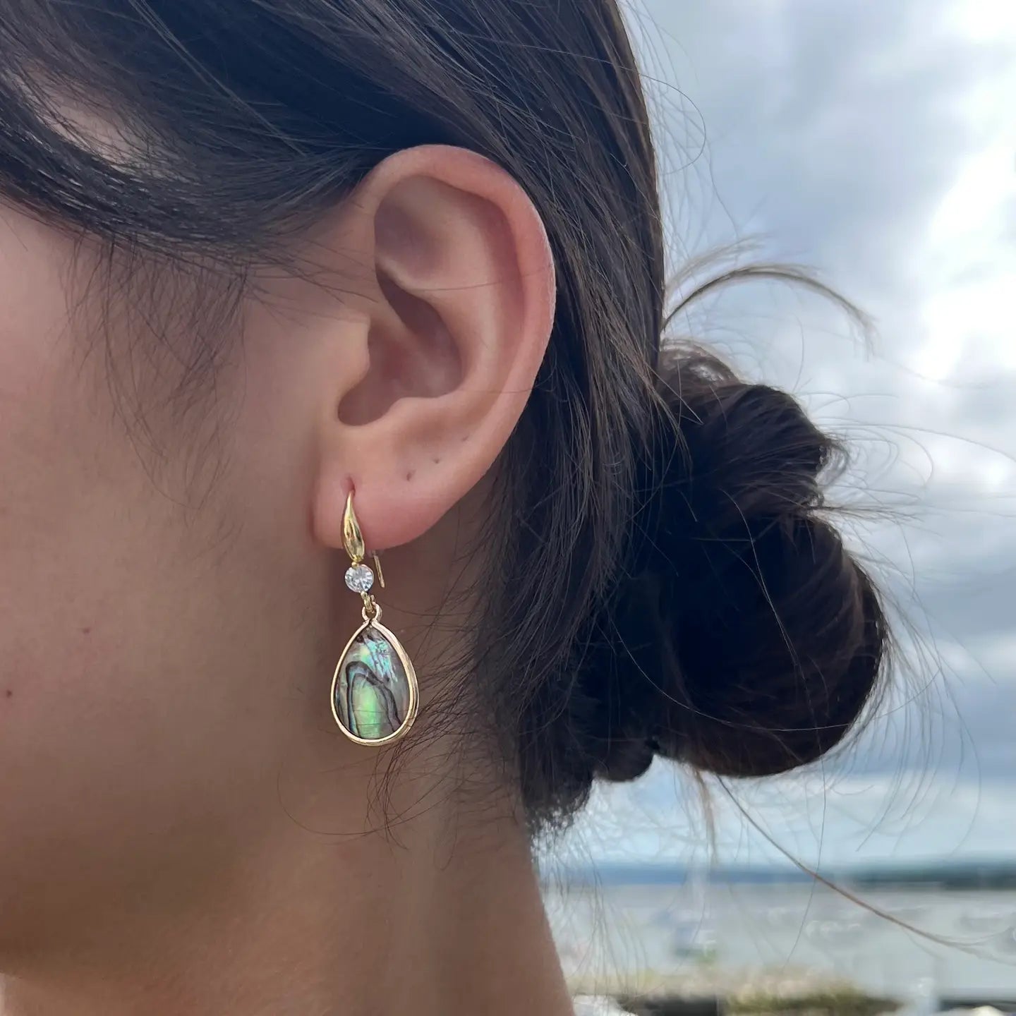 Ocean Ripples Gold  and Abalone teardrop earrings on a Model