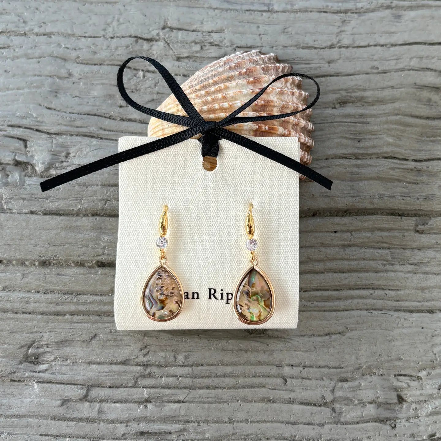 Ocean Ripples Gold  and Abalone teardrop earrings on branded card