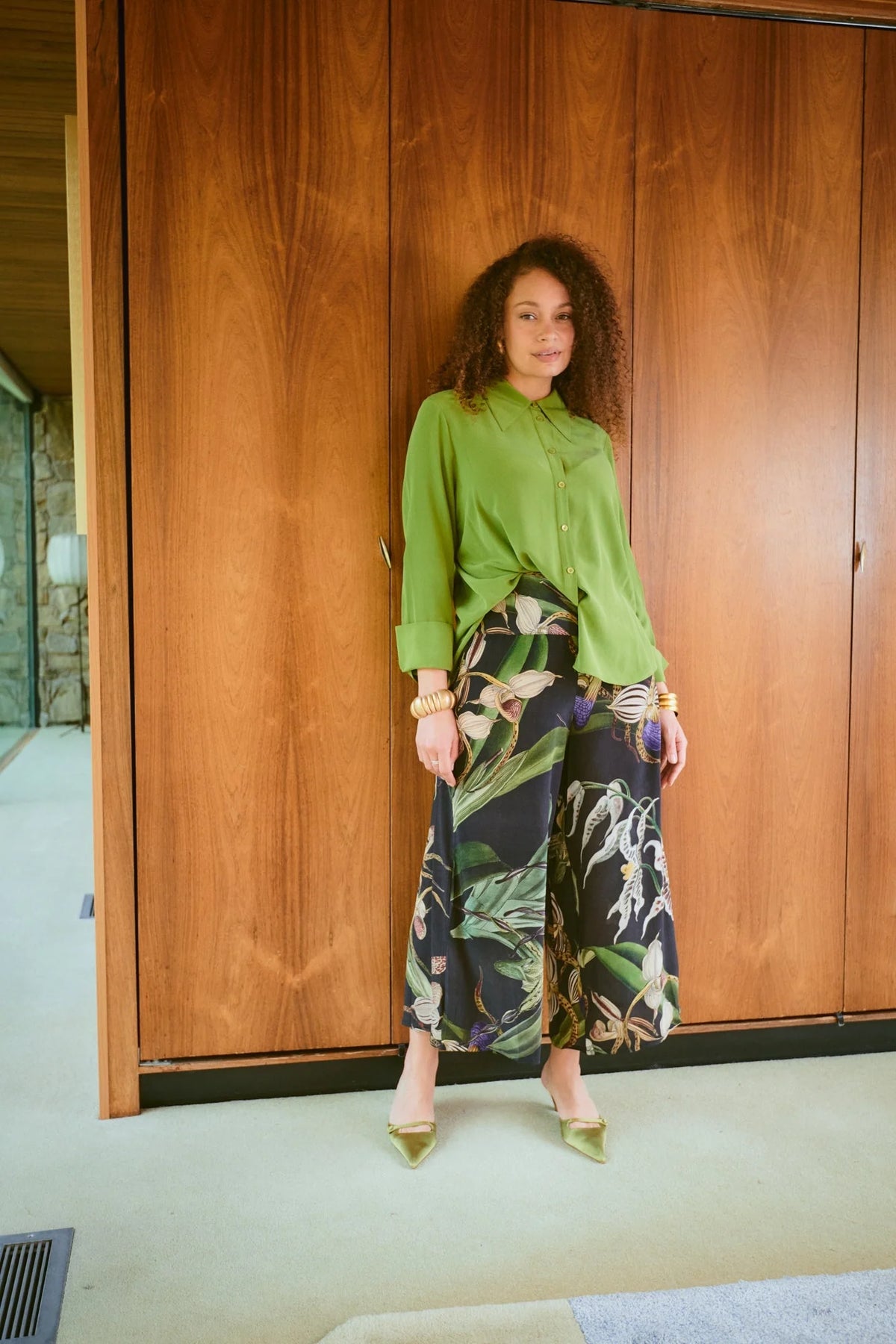 One Hundred Stars Orchid Black Crepe Palazzo Pants with botanical orchid print, black background and flowing wide-leg silhouette