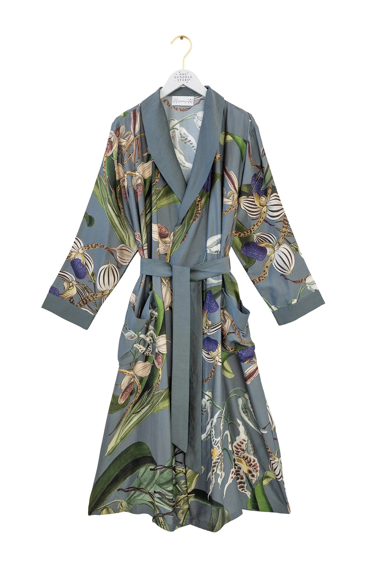 One Hundred Stars Orchid Grey Gown featuring an elegant botanical orchid print on a soft grey background with a flowing silhouette