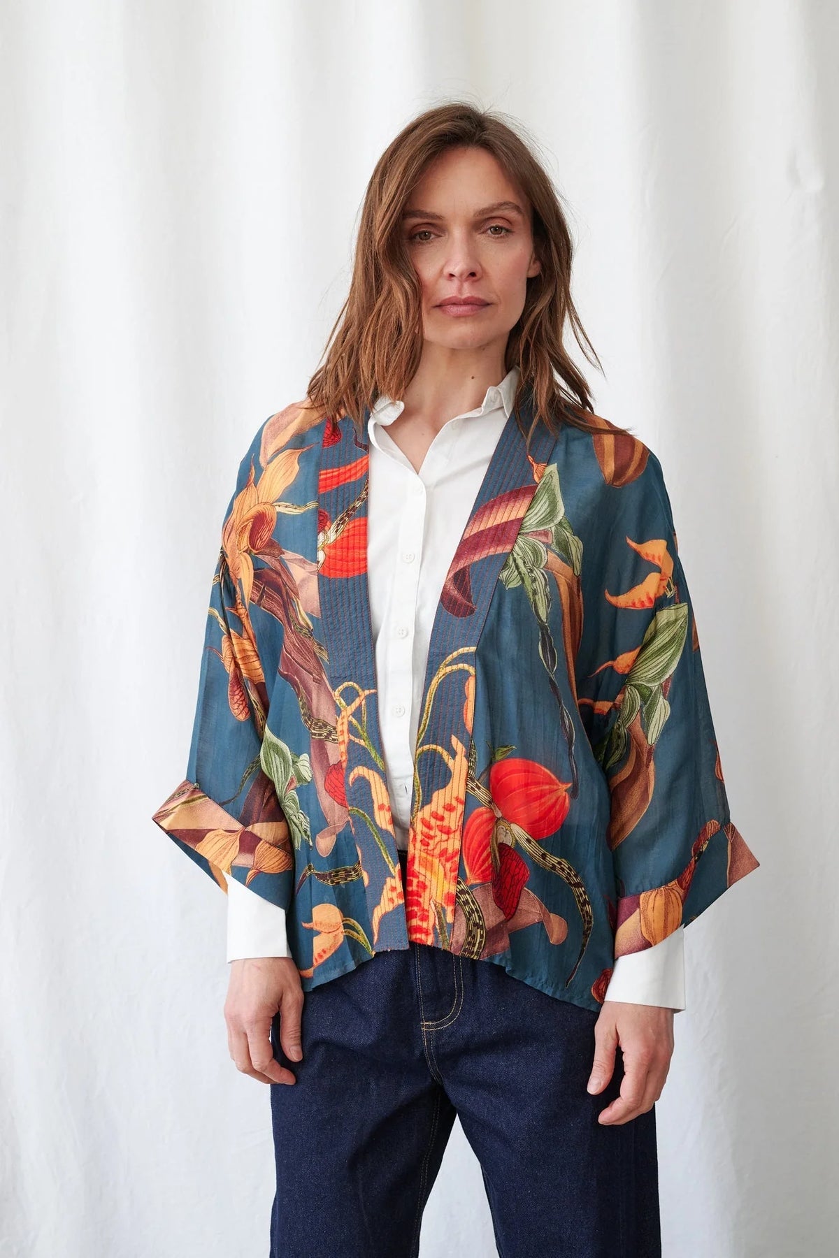 One Hundred Stars Orchid Teal Kimono featuring an elegant botanical orchid print in teal tones with a relaxed flowing silhouette