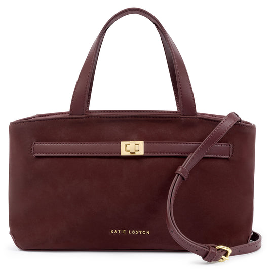 Katie Loxton Orin top handle crossbody bag in cherry suedette with gold hardware and detachable crossbody strap.