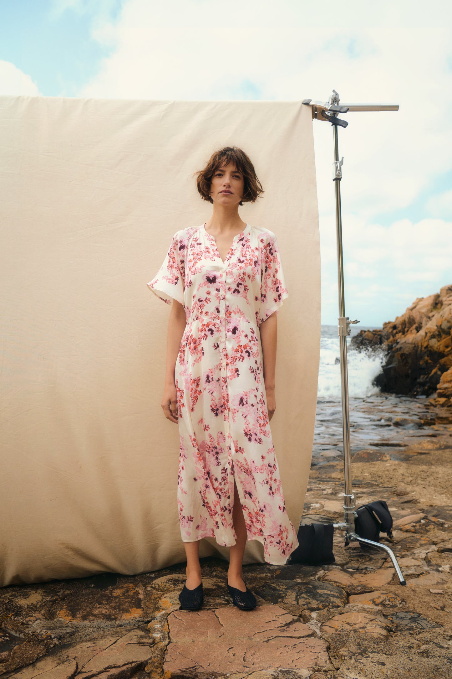 Woman in the Part Two Alaja maxi white floral dress with pink flowers on it