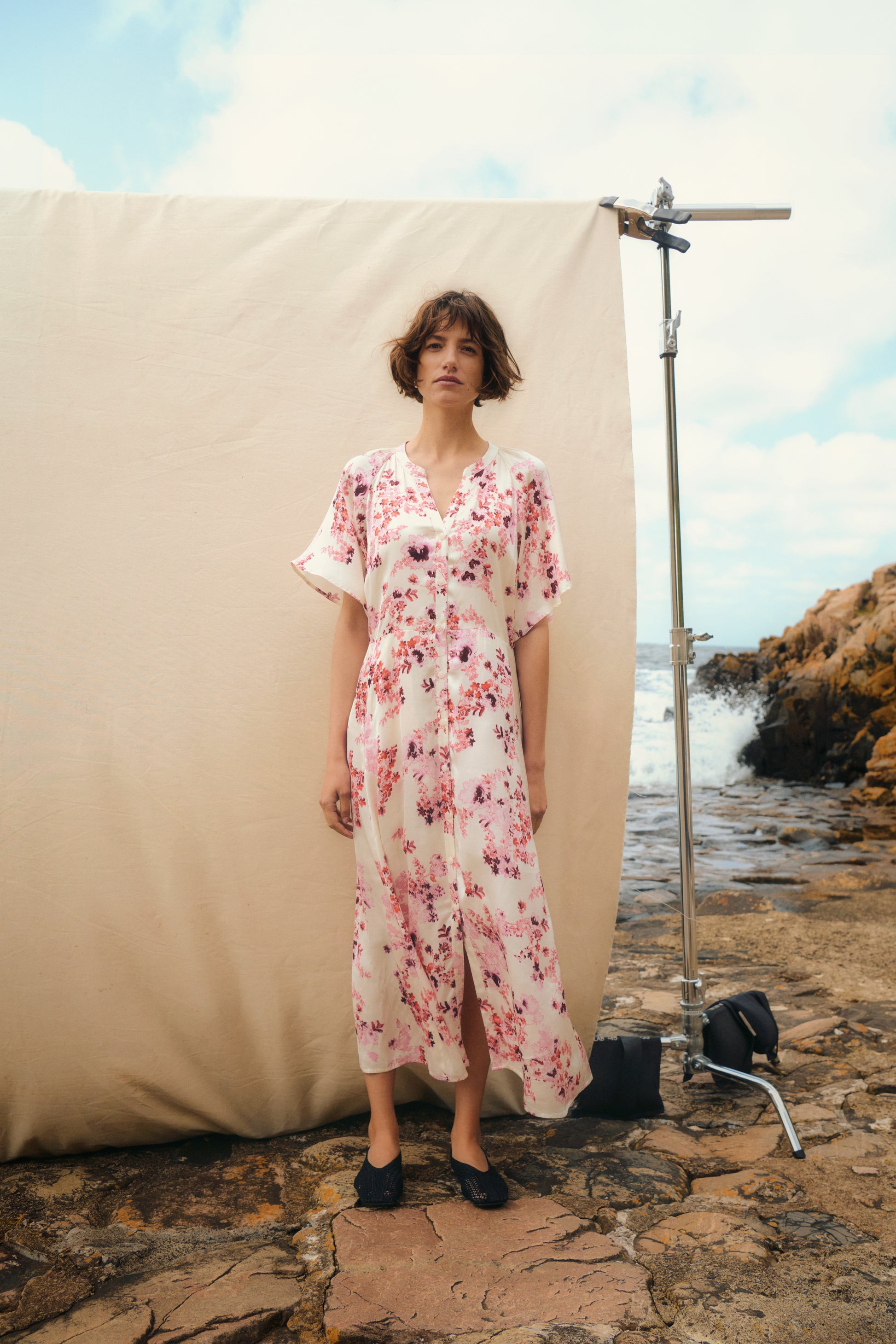 Woman in the Part Two Alaja maxi white floral dress with pink flowers on it