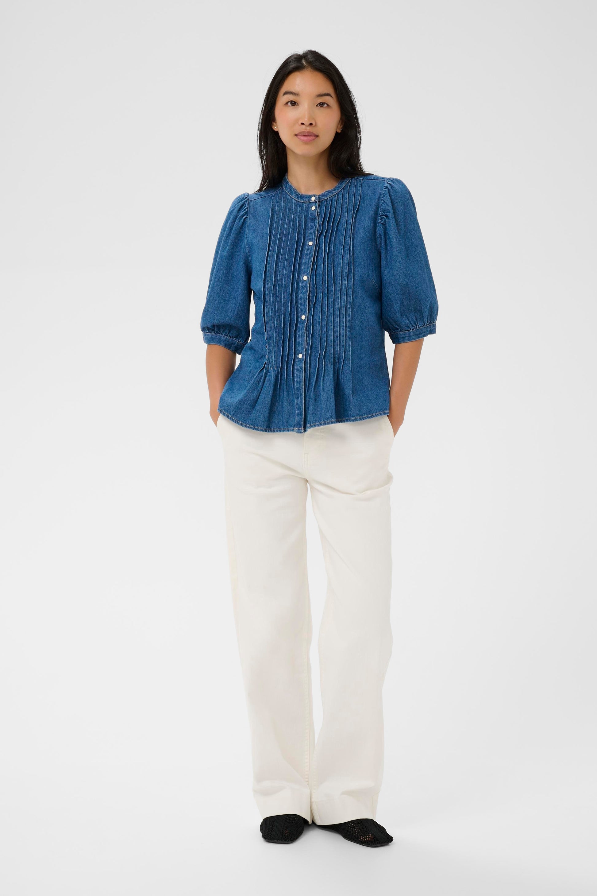 Woman wearing the Part two Alesia Denim Shirt with 3/4 sleeves and folded detailing at the front.
