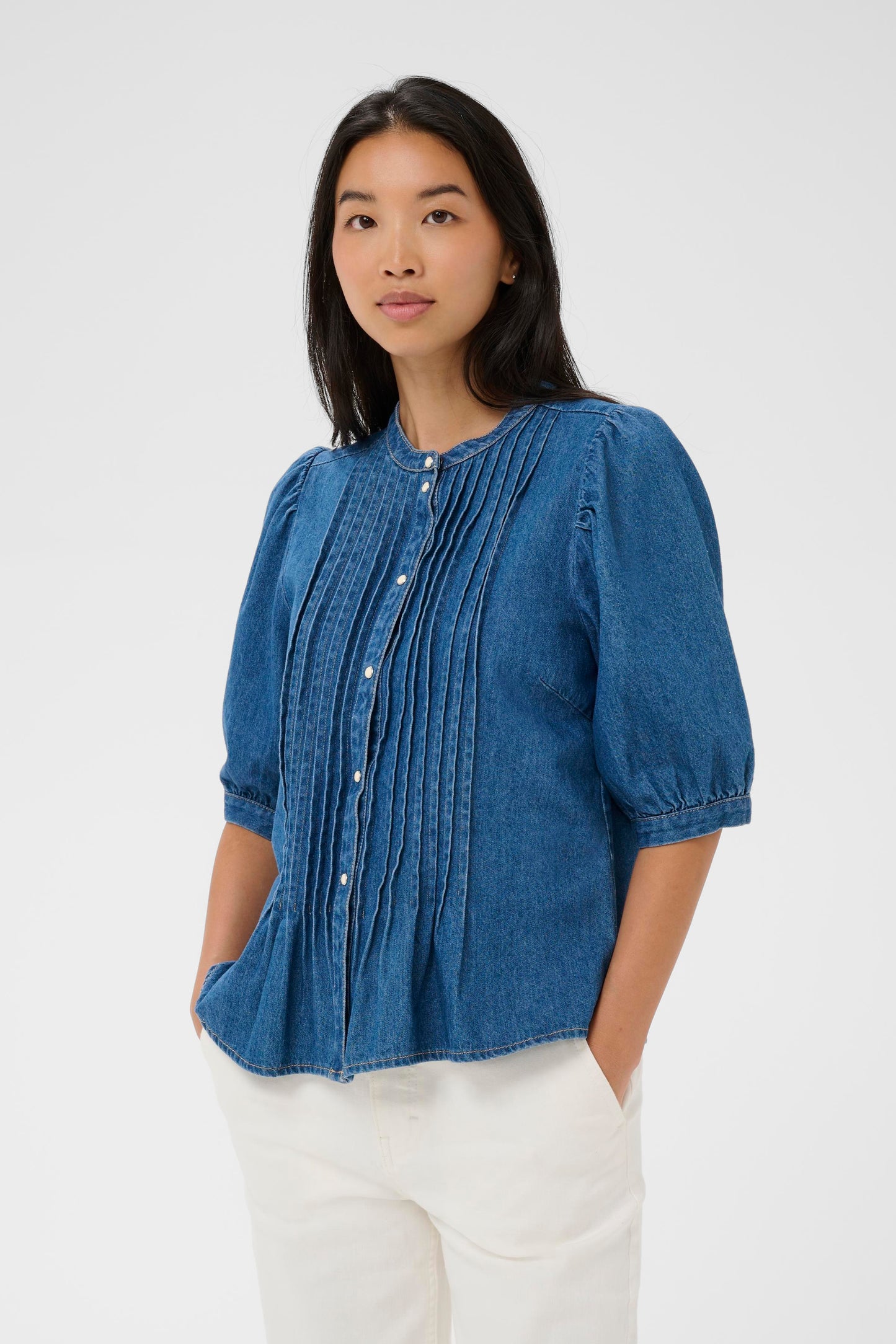 Woman wearing the Part two Alesia Denim Shirt with 3/4 sleeves and folded detailing at the front.